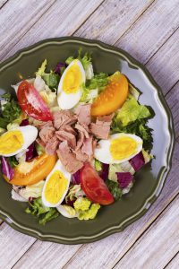 Tuna, egg and vegetable salad. View from above, top studio shot